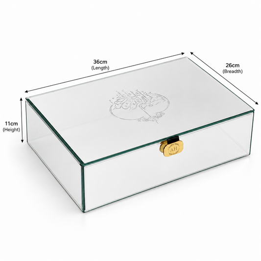 Clear glass rectangular storage box with a gold clasp and Arabic calligraphy engraving on the lid, shown with dimension labels indicating 36cm length, 26cm breadth, and 11cm height.