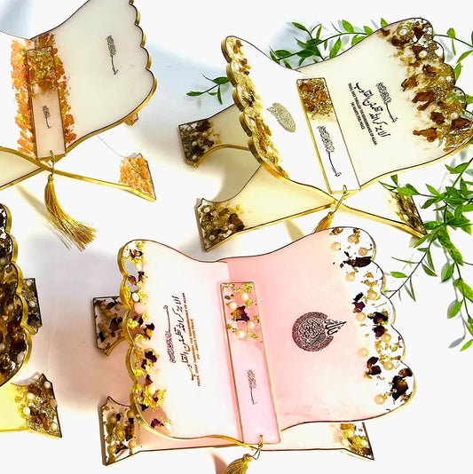 Handmade resin Quran stand with pressed flowers and personalized name engraving.