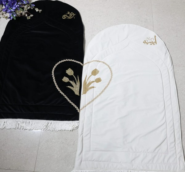 Personalised velvet couple prayer rug set in black and white rose design, luxury handmade Islamic wedding gift and Nikah prayer mat for Muslim couples.