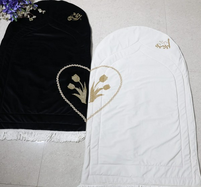 Personalised velvet couple prayer rug set in black and white rose design, luxury handmade Islamic wedding gift and Nikah prayer mat for Muslim couples.