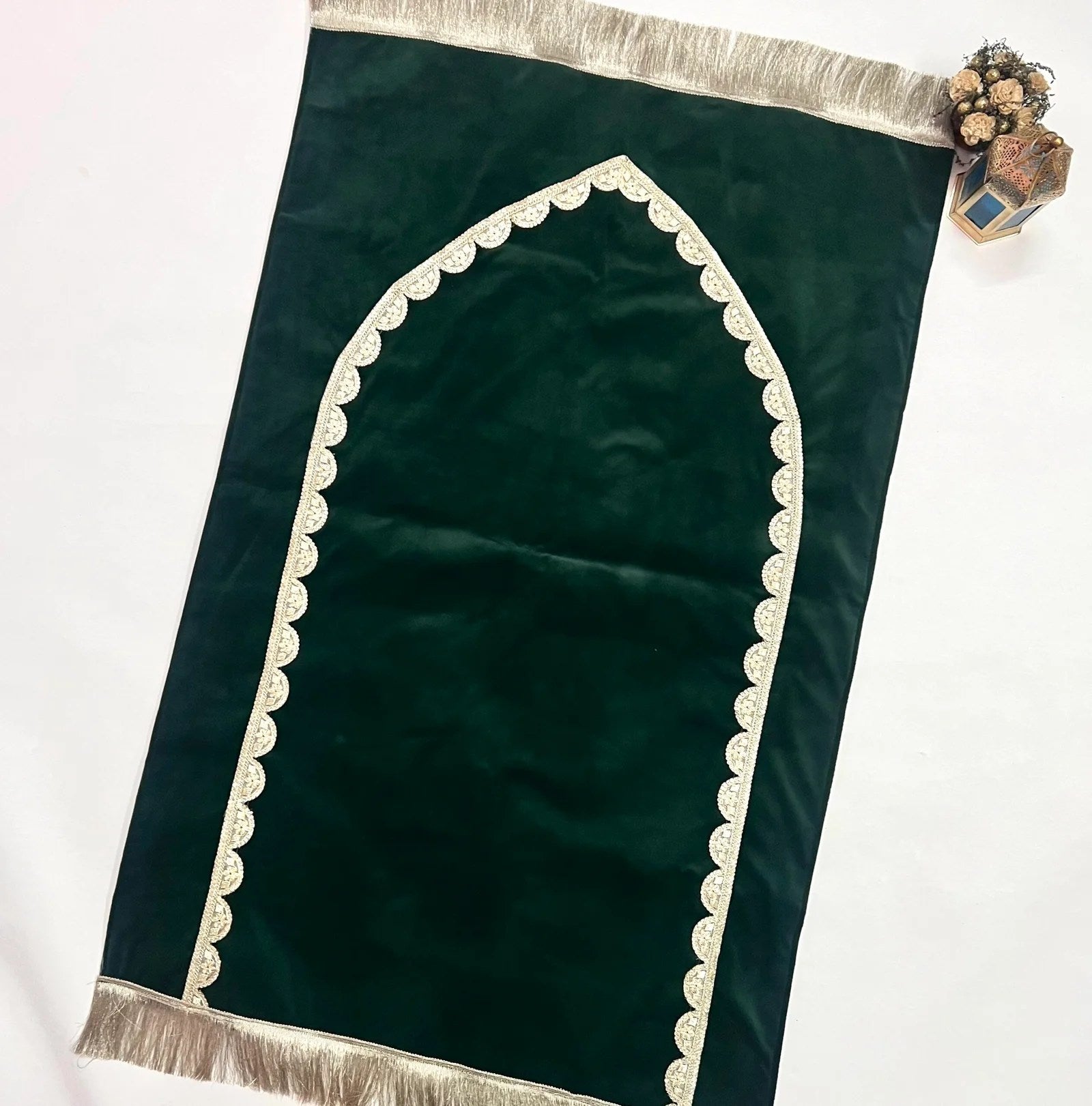 Elegant olive green velvet prayer mat with golden lace trim and personalized name.