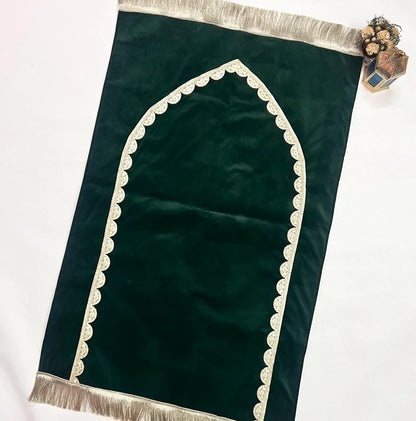 Elegant olive green velvet prayer mat with golden lace trim and personalized name.