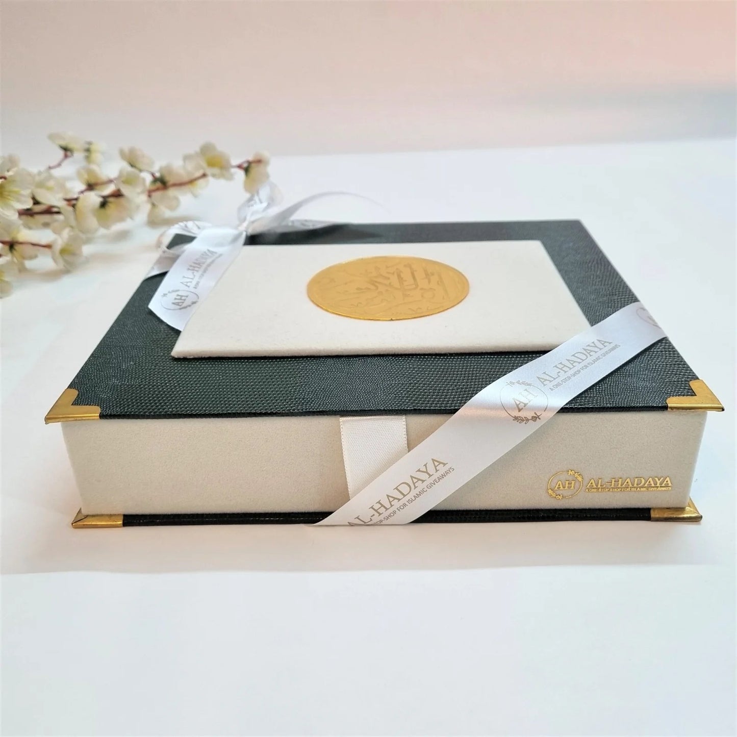 Elegant Islamic Quran gift box in bottle green and off-white velvet with perfume and tasbih.