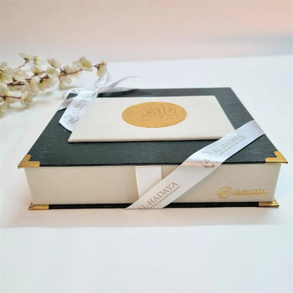 Elegant Islamic Quran gift box in bottle green and off-white velvet with perfume and tasbih.