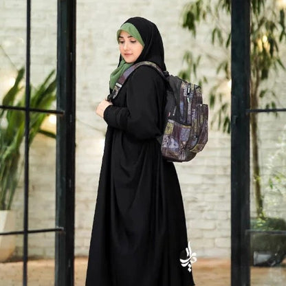 Elegant black abaya for girls featuring front zipper and modest design.