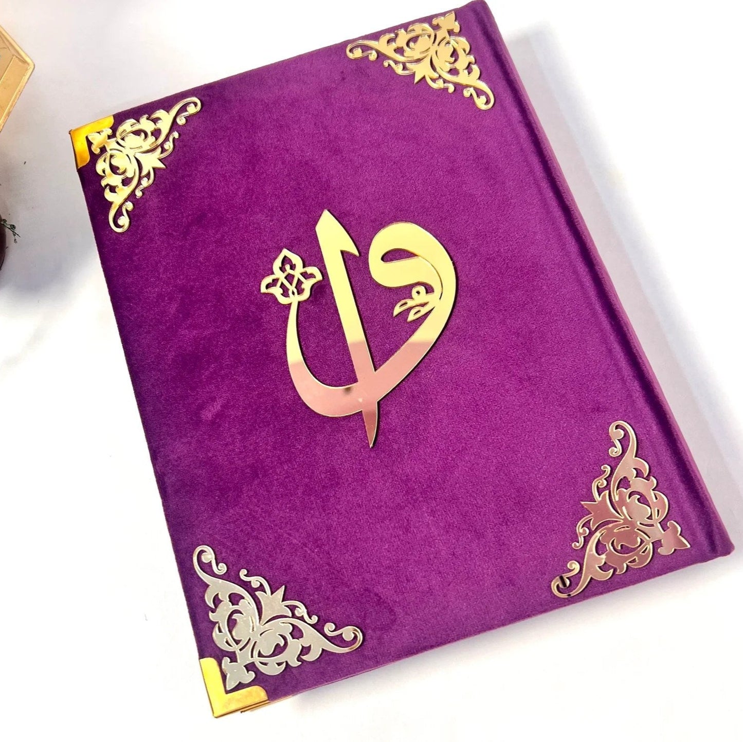 Luxurious Islamic prayer essentials set in deep purple with velvet Quran, resin accessories, and Turkish mat.