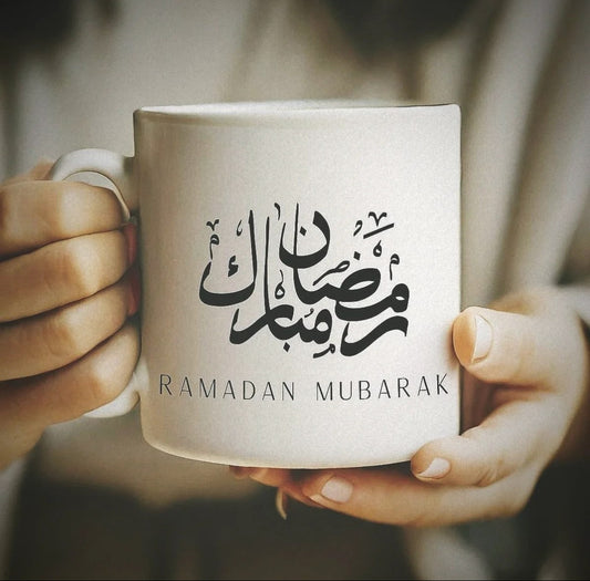 Ramadan Mubarak ceramic coffee mug with Arabic calligraphy design.