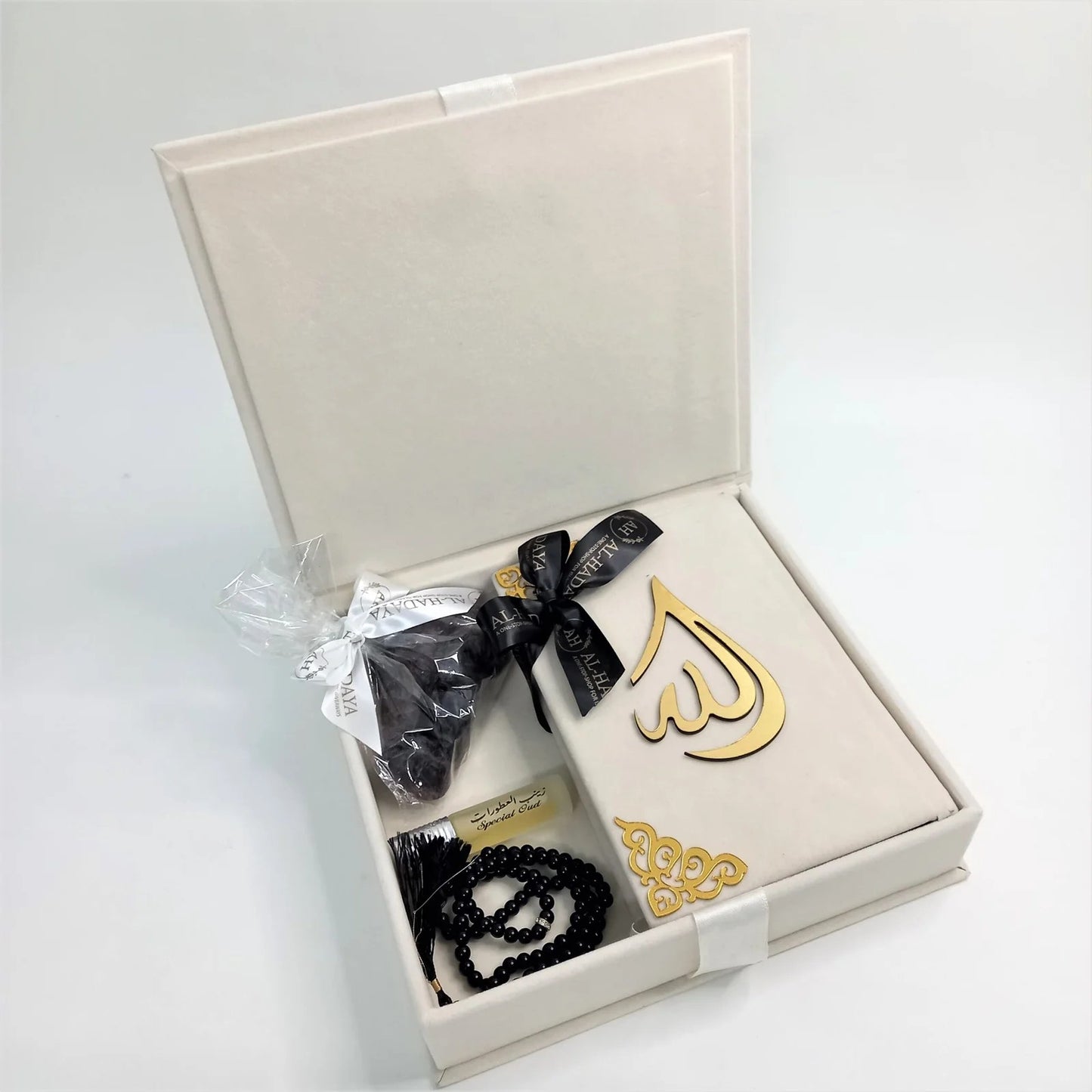 Handmade Islamic gift box with Quran, tasbih, and perfume beautifully arranged.