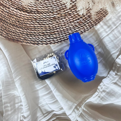 Zam Zam water 250ml bottle in original Saudi Arabia packing, authentic holy water from Makkah for Islamic rituals and gifting.