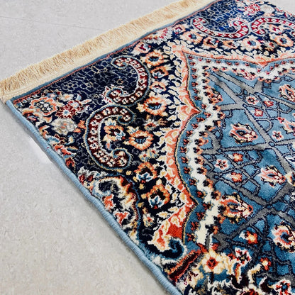 Thick plush Turkish prayer carpet hand-finished for comfort.