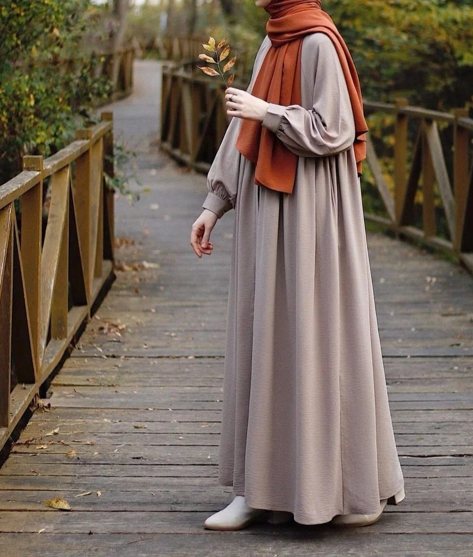 Solid Nida fabric maxi abaya with cuffed sleeves and side pockets for women.