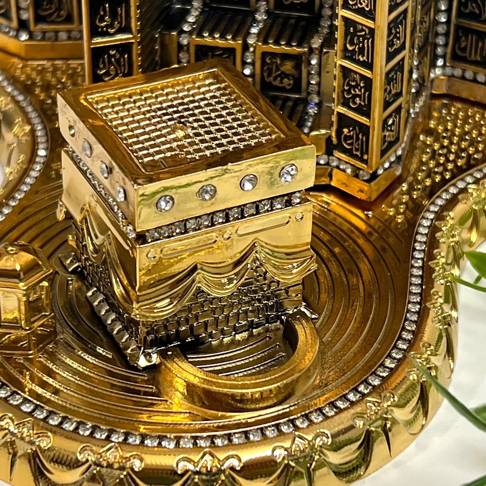 Islamic home decor replica of Makkah’s clock tower inscribed with 99 names of Allah.