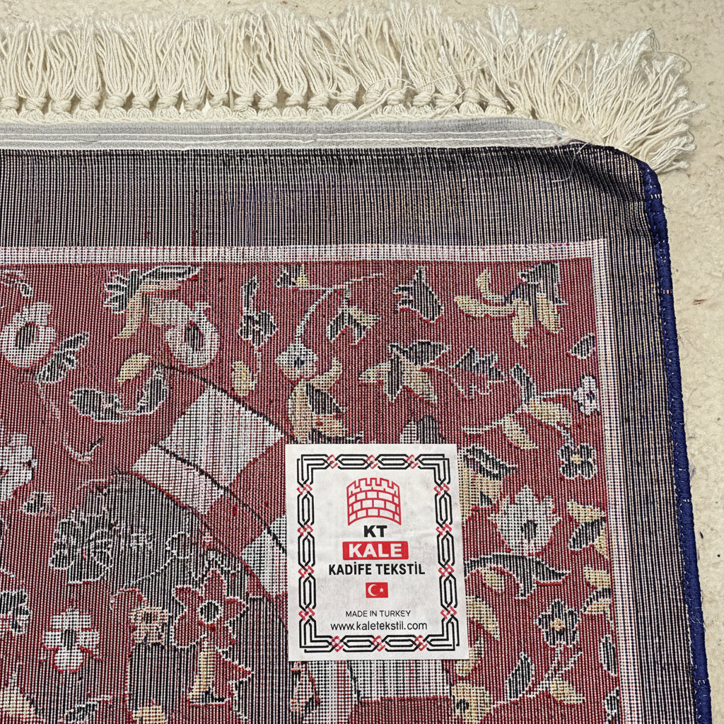 Premium floral Turkish prayer mat styled in a luxury Islamic prayer setting