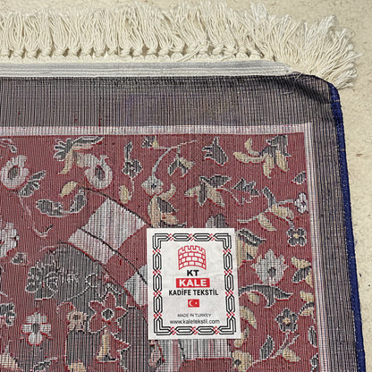 Premium floral Turkish prayer mat styled in a luxury Islamic prayer setting