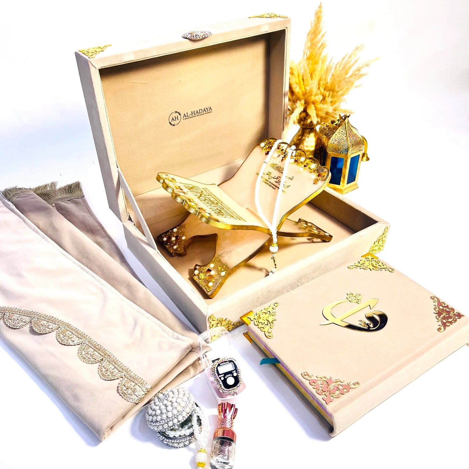 Luxury Hubb Al-Iman Quran gift set by Al-Hadaya with velvet-covered rainbow Quran, Turkish prayer mat, resin rehal, tasbih, attar and velvet box