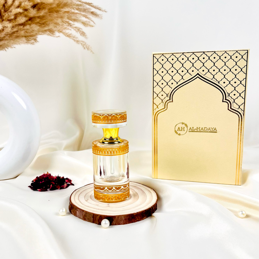 Premium Arabic attar in white crystal packaging with long-lasting oud fragrance.