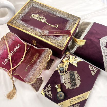 Elegant wine Quran hamper with resin Quran stand, digital counter, turkish tasbeeh, halal attar, and prayer essentials.