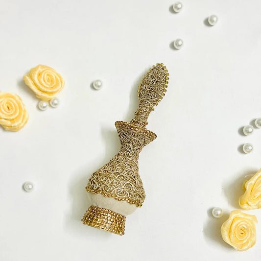 Handmade Zahra Surmadani in ivory velvet with golden detailing for wedding ceremonies.