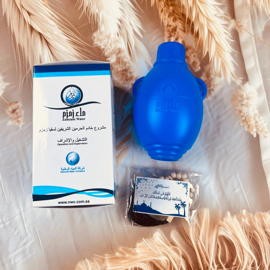 Zam Zam water 250ml bottle in original Saudi Arabia packing, authentic holy water from Makkah for Islamic rituals and gifting.