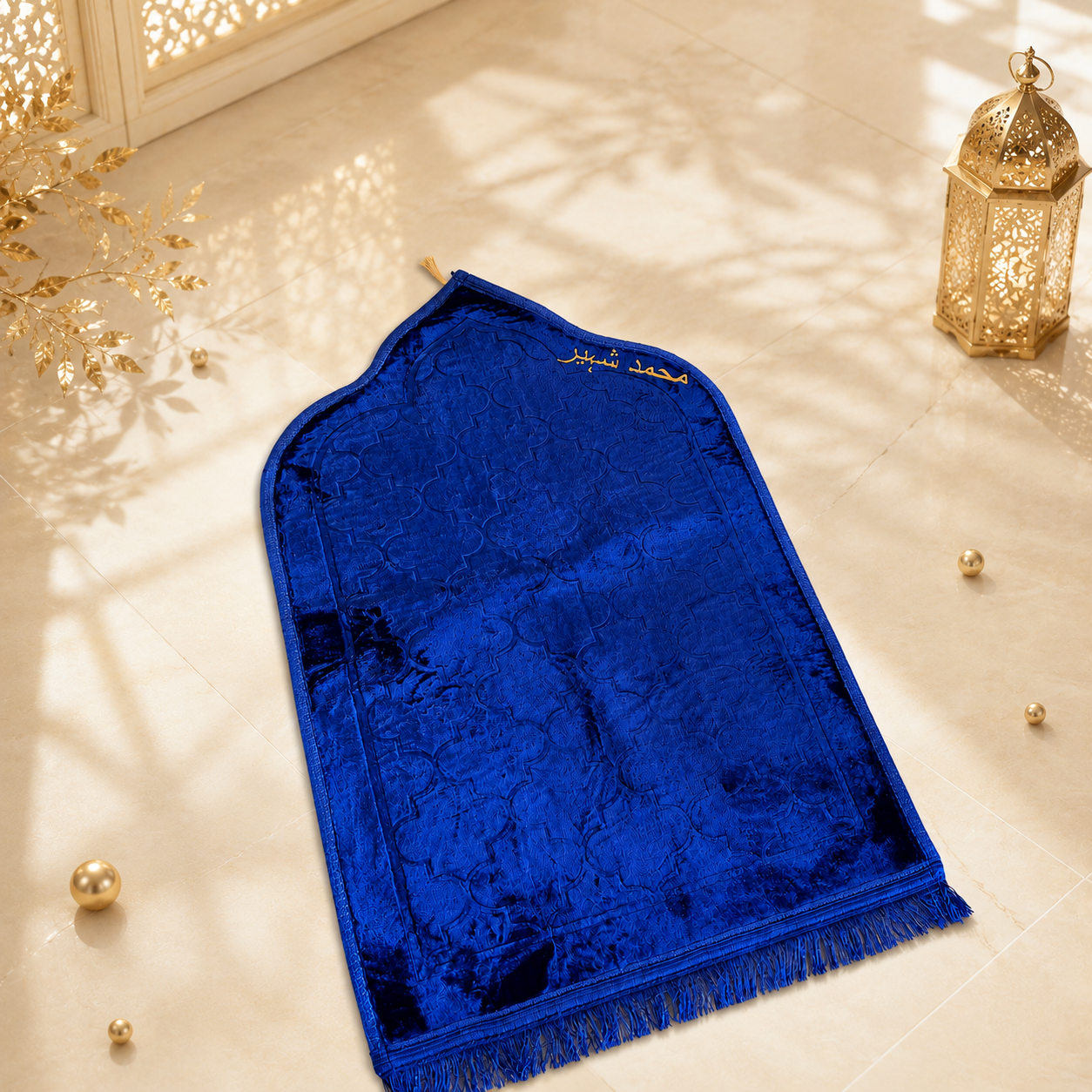 Blue prayer mat with gold text on a light wooden floor with decorative elements.