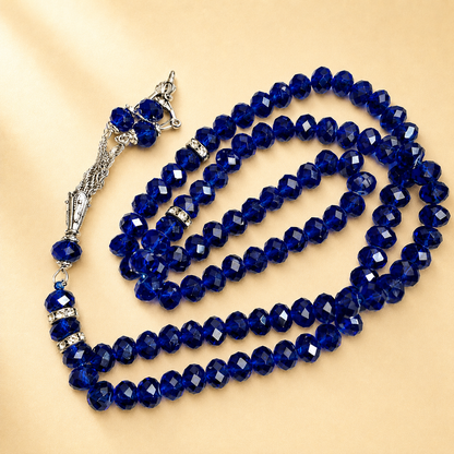 Blue beaded tasbih on a beige background