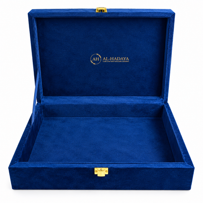 An open royal blue velvet jewelry box with gold-tone latches and a gold 'AL-HADAYA' logo printed on the inside lid, set against a plain white background.