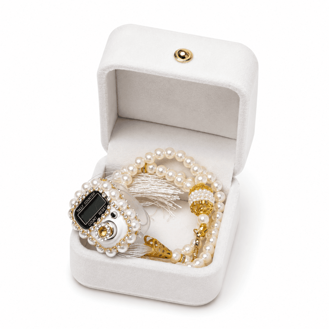 Pearl and gold tasbih in a white jewelry box on a white background
