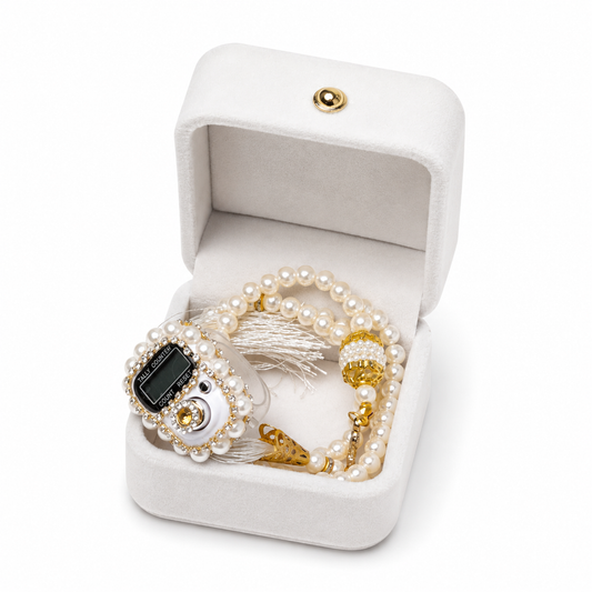 Pearl and gold tasbih in a white jewelry box on a white background