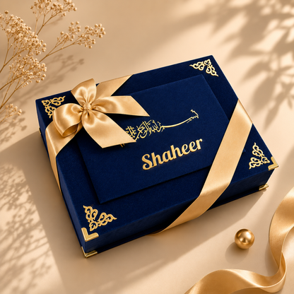 Blue gift box with gold ribbon and 'Shaheer' branding on a beige background