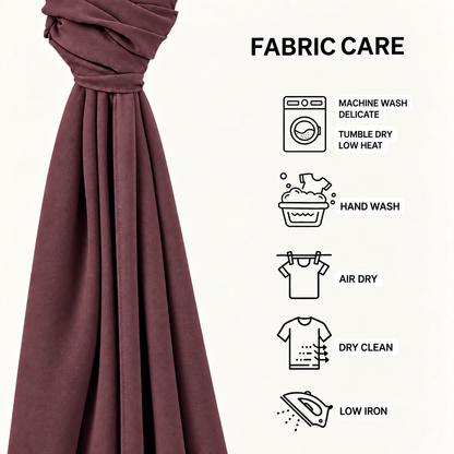 A close-up of a draped dusty burgundy fabric next to a 'FABRIC CARE' infographic on a white background, detailing care instructions with icons and text.