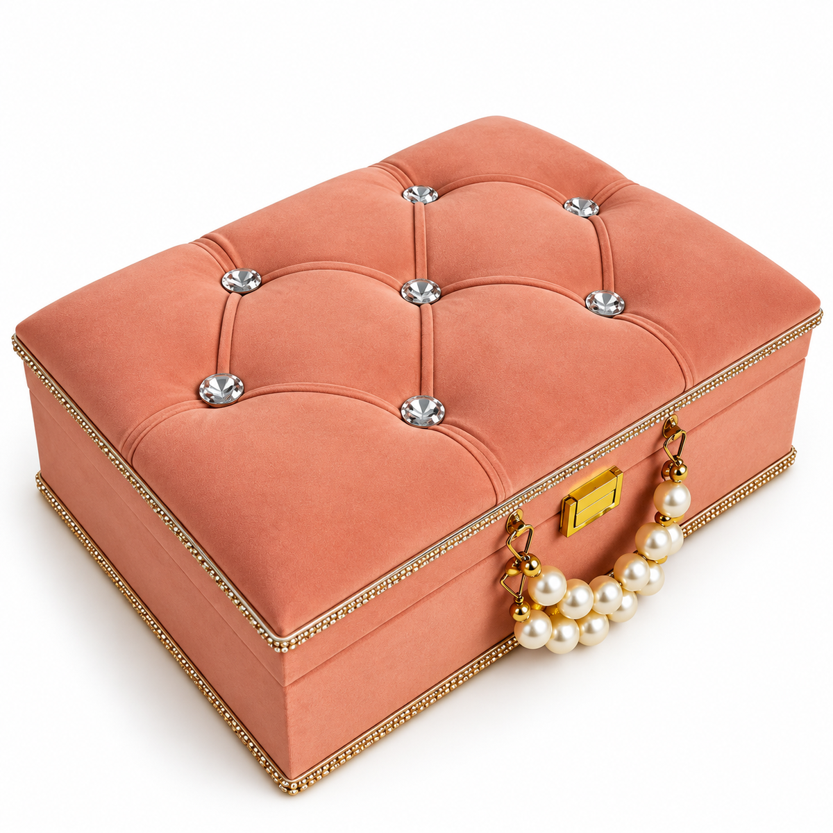 A square coral pink velvet jewelry box with tufted button details, silver crystal accents, a gold-tone clasp, and a pearl-and-gold handle, shown on a white background.