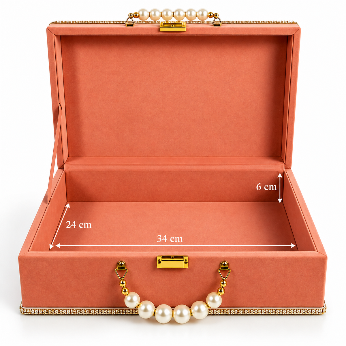 An open coral-pink jewelry box with gold-tone hardware and a pearl handle, shown on a white background with overlaid dimension labels indicating 24 cm width, 34 cm depth, and 6 cm height.