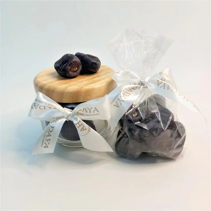 fresh original dates in wooden glass jar 