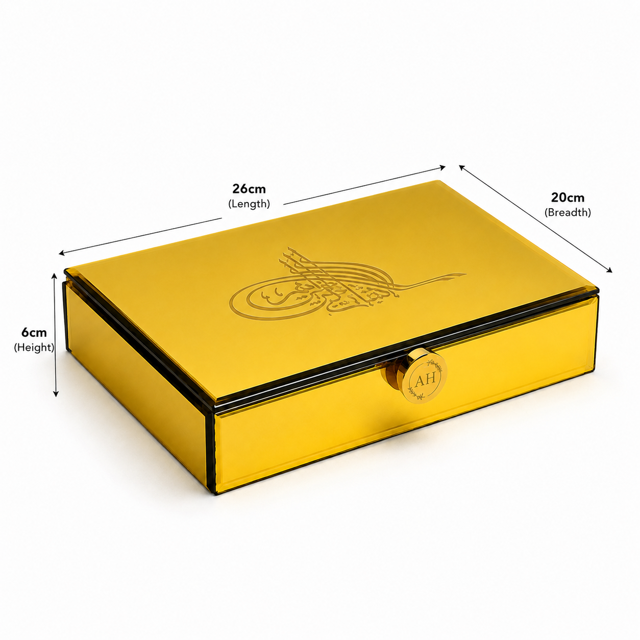 A metallic gold rectangular storage box with a hinged front and an engraved Arabic calligraphy design on the lid, shown with dimension arrows and labels indicating 26cm length, 20cm breadth, and 6cm height on a white background.