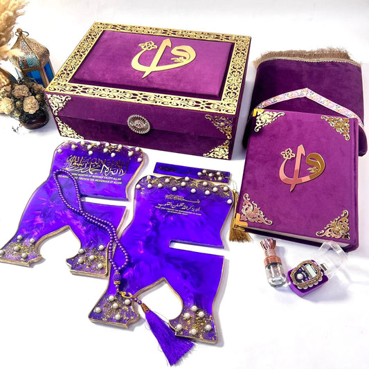 Premium purple Quran gift set from Al-Hadaya’s Hubb Al-Iman Collection featuring velvet Quran, Turkish prayer mat, tasbih, and attar.