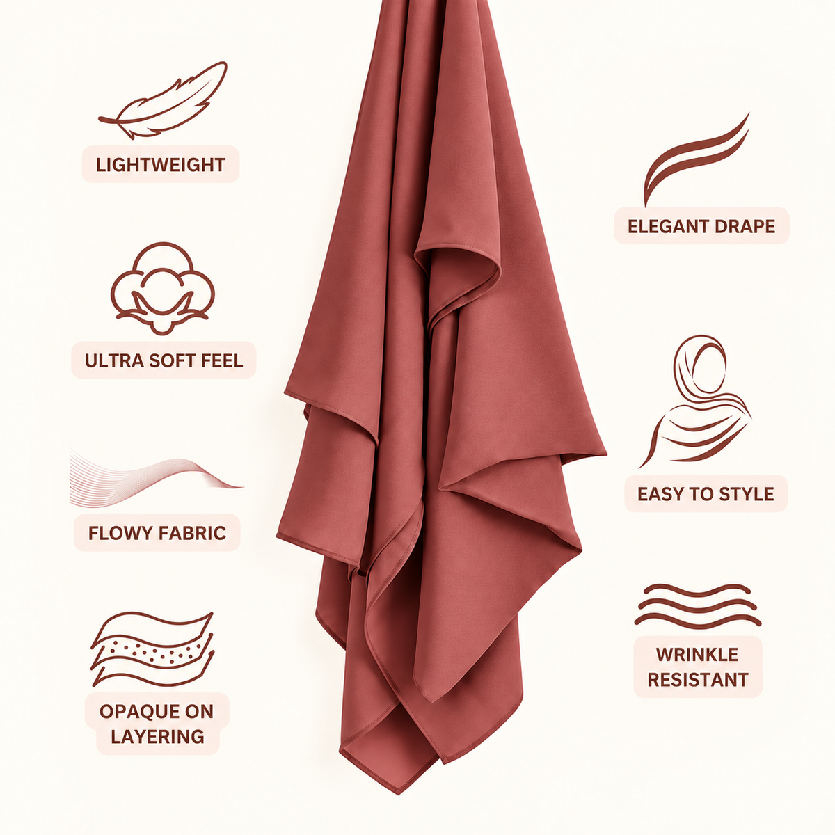A dusty rose pink draped fabric, likely a hijab or scarf, shown against a light cream background with feature callouts and icons for lightweight, elegant drape, ultra soft feel, flowy fabric, easy to style, opaque on layering, and wrinkle resistant.