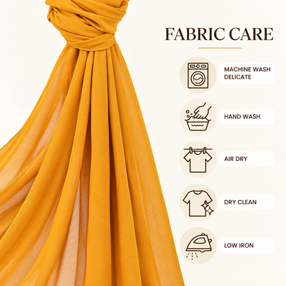 A draped mustard yellow fabric shown next to a 'FABRIC CARE' infographic on a light cream background, listing care instructions with icons for machine wash, hand wash, air dry, dry clean, and low iron.